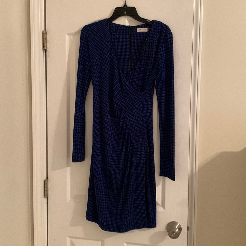 Calvin Klein size 4 form fitting, silky work dress